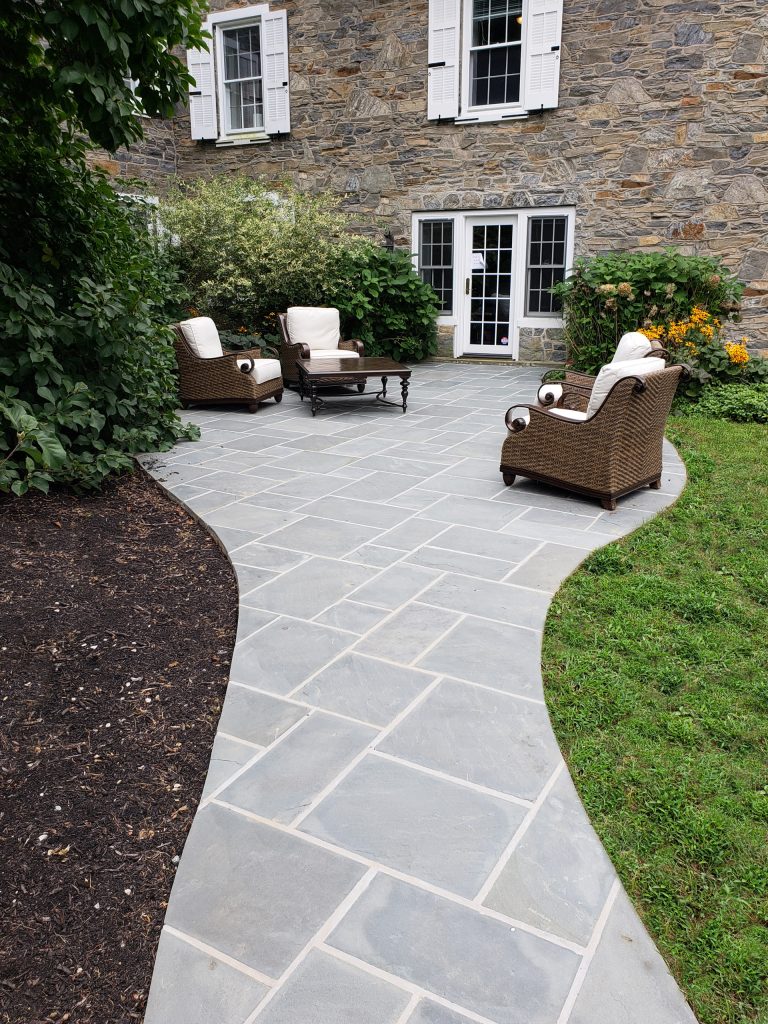 Inspiration for a huge timeless backyard stone patio kitchen remodel in Other
