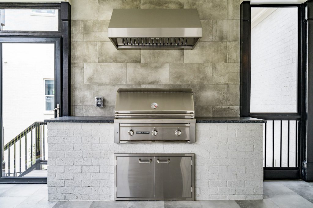 Inspiration for a huge transitional back porch remodel in Raleigh with a fireplace and a roof extension by Poythress Construction Company Inc. | Outdoor Photos | Porch | Landscaping | Landscape Design | Outdoor Living Space | Porch Design Ideas | Outdoor Living Space Ideas | Backyard Design