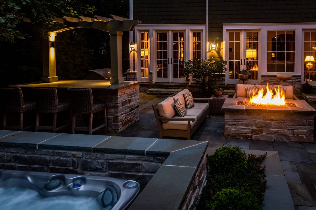 Inspiration for a huge transitional backyard stone patio kitchen remodel in Chicago with no cover