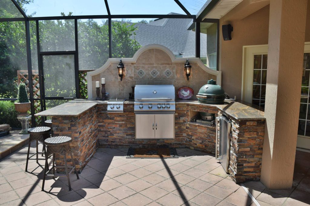 Inspiration for a huge transitional backyard tile patio kitchen remodel in Jacksonville