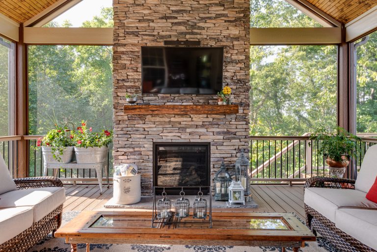 Inspiration for a large back porch remodel in Nashville with a fireplace, decking and a roof extension by The Kingston Group - Remodeling Specialists | Outdoor Photos | Porch | Landscaping | Landscape Design | Outdoor Living Space | Porch Design Ideas | Outdoor Living Space Ideas | Backyard Design