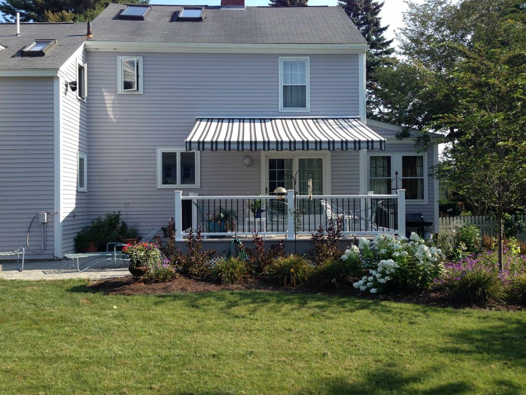 Inspiration for a large back porch remodel in Portland Maine with an awning by NuImage Awnings of Maine | Outdoor Photos | Porch | Landscaping | Landscape Design | Outdoor Living Space | Porch Design Ideas | Outdoor Living Space Ideas | Backyard Design