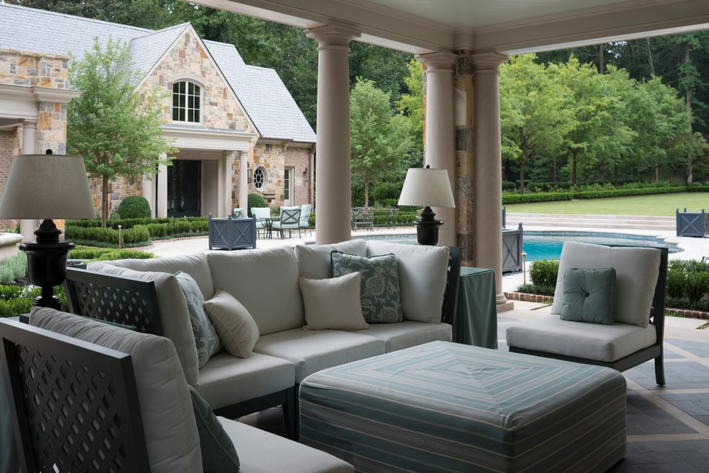 Inspiration for a large backyard tile patio kitchen remodel in Jacksonville with a roof extension