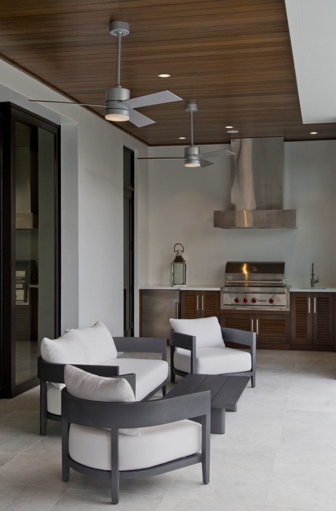 Inspiration for a large coastal backyard tile and custom-shaped hot tub remodel in Miami