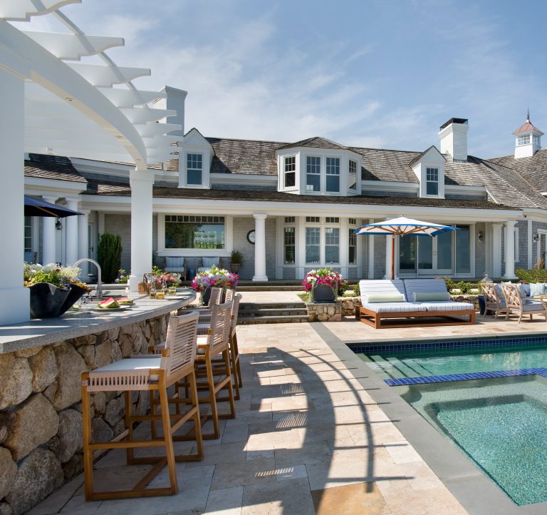 Inspiration for a large coastal backyard tile patio kitchen remodel in Boston with a pergola