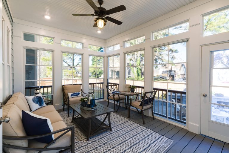Inspiration for a large coastal screened-in back porch remodel in Other with a roof extension by Stephen Alexander Homes & Neighborhoods | Outdoor Photos | Porch | Landscaping | Landscape Design | Outdoor Living Space | Porch Design Ideas | Outdoor Living Space Ideas | Backyard Design