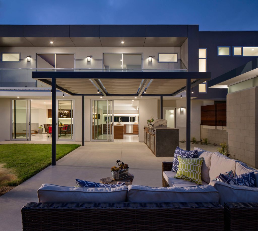 Inspiration for a large contemporary backyard concrete patio kitchen remodel in San Diego with a gazebo