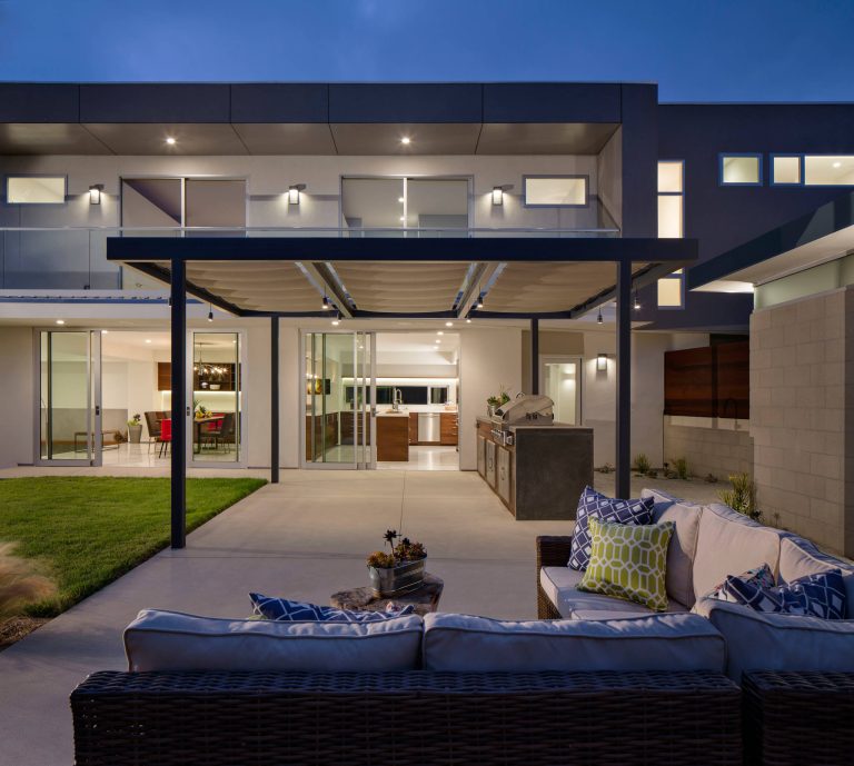 Inspiration for a large contemporary backyard concrete patio kitchen remodel in San Diego with a gazebo