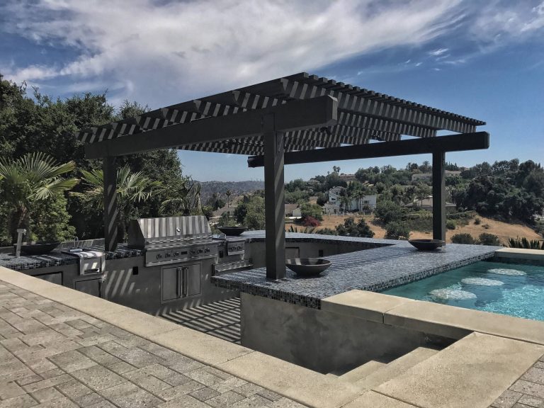 Inspiration for a large contemporary backyard concrete paver and rectangular infinity hot tub remodel in Los Angeles