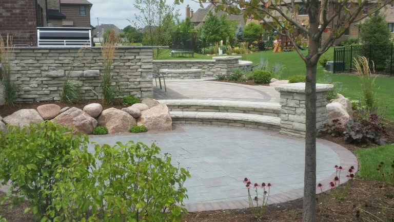 Inspiration for a large contemporary backyard concrete paver patio kitchen remodel in Chicago with no cover