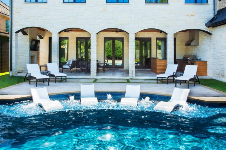 Inspiration for a large contemporary backyard custom-shaped lap hot tub remodel in Houston