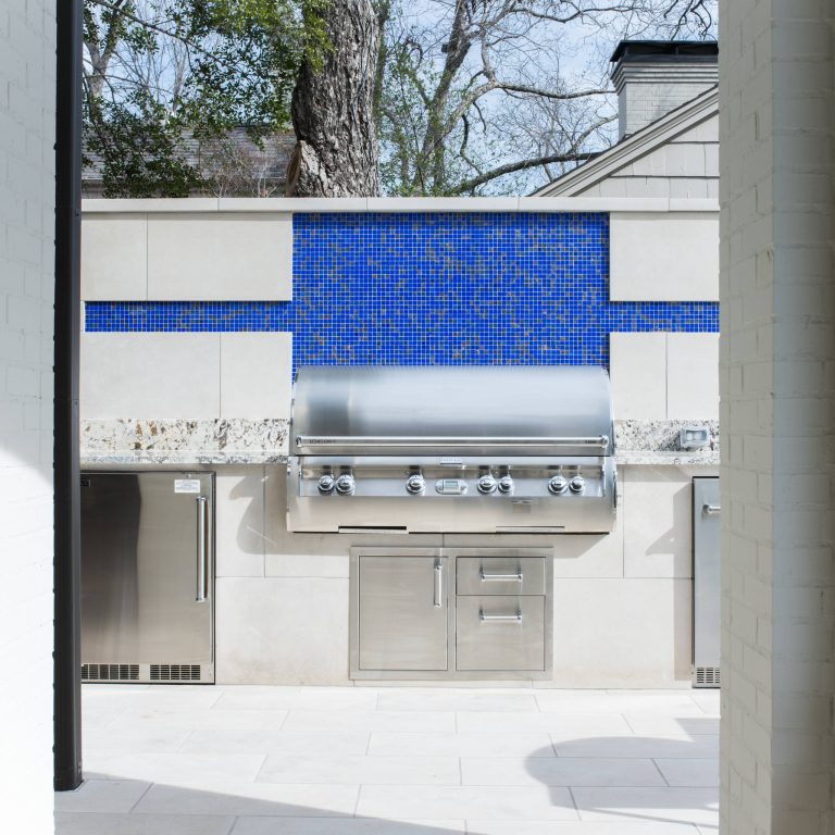 Inspiration for a large contemporary backyard patio kitchen remodel in Dallas with a roof extension