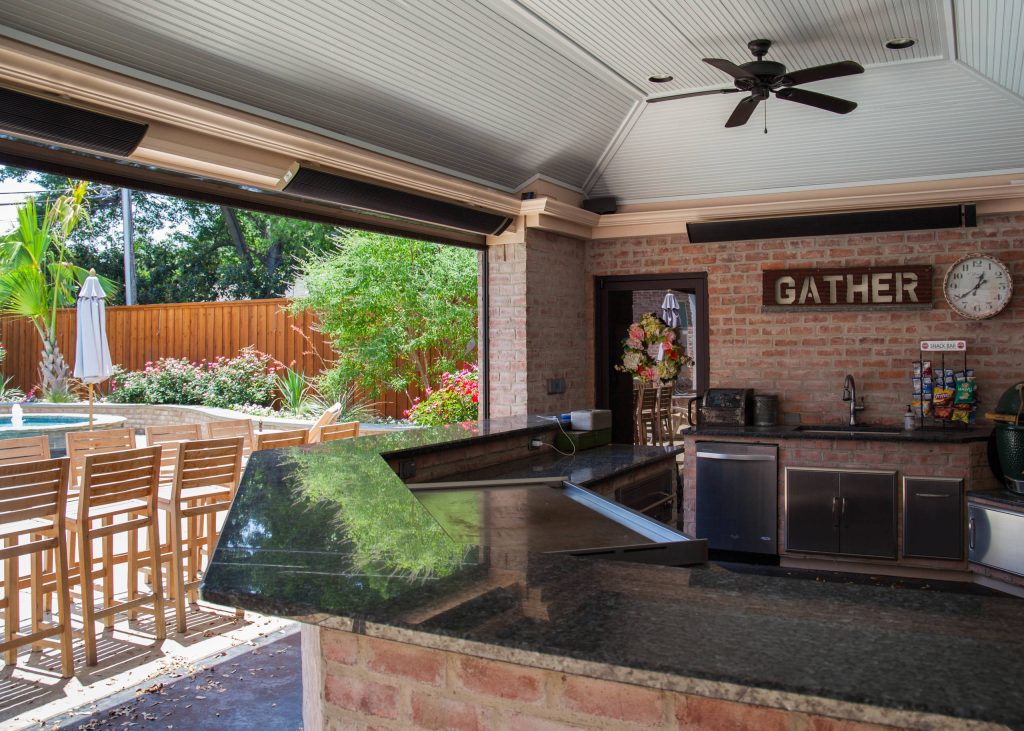 Inspiration for a large contemporary backyard stamped concrete patio kitchen remodel in Dallas with a gazebo