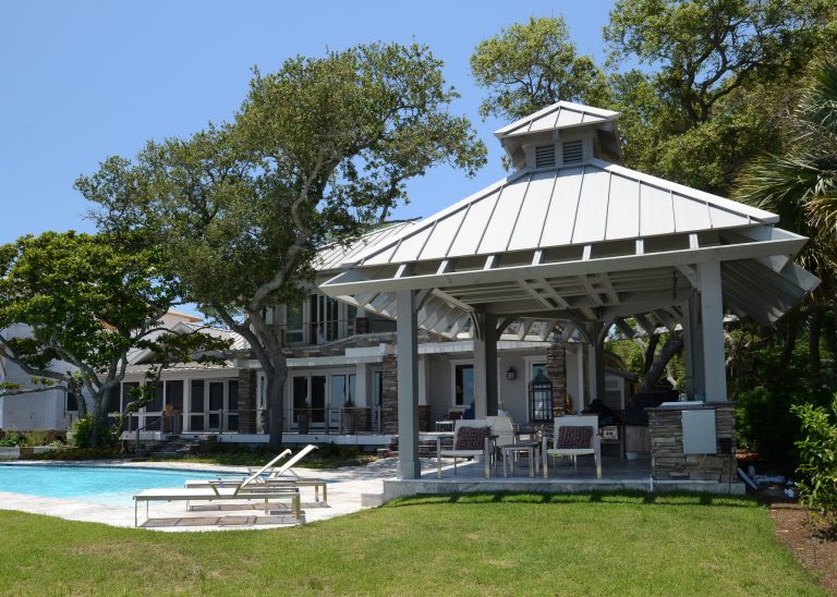 Inspiration for a large contemporary backyard stamped concrete patio kitchen remodel in Miami with a gazebo