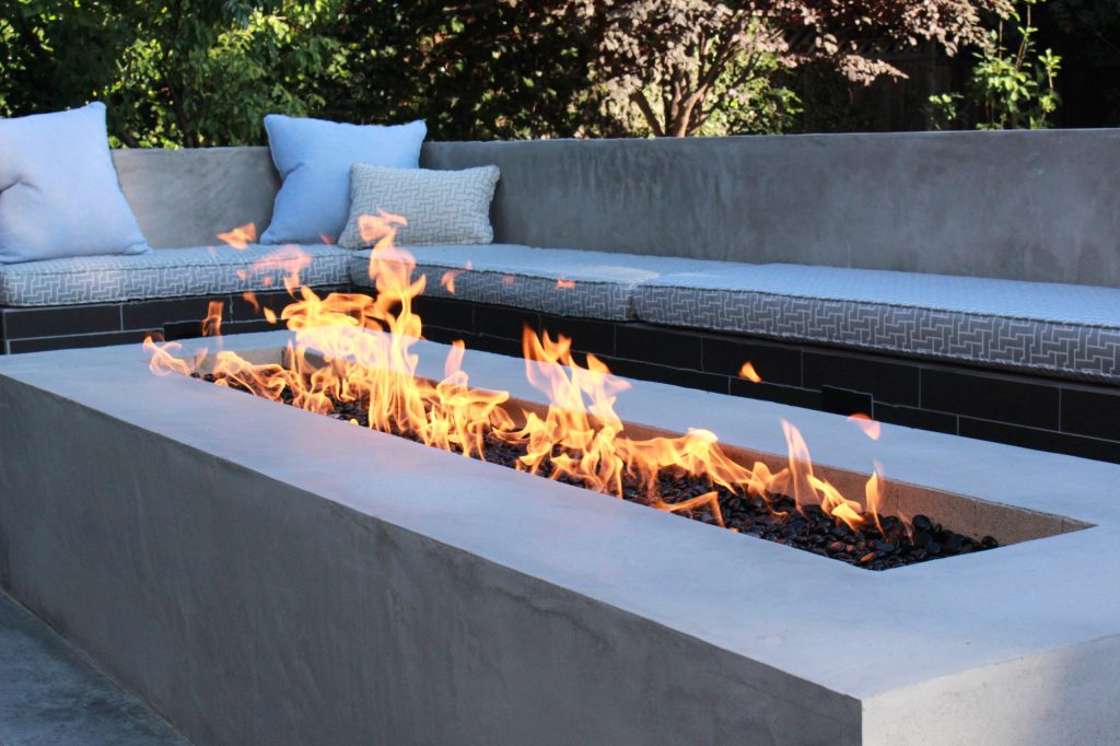 Inspiration for a large contemporary backyard stamped concrete patio kitchen remodel in San Francisco with no cover
