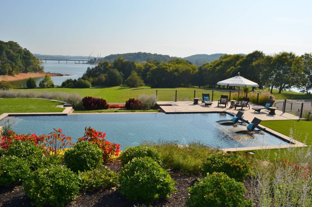 Inspiration for a large contemporary backyard stone and rectangular lap hot tub remodel in Other