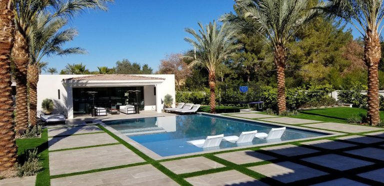 Inspiration for a large contemporary backyard stone and rectangular lap pool house remodel in Phoenix