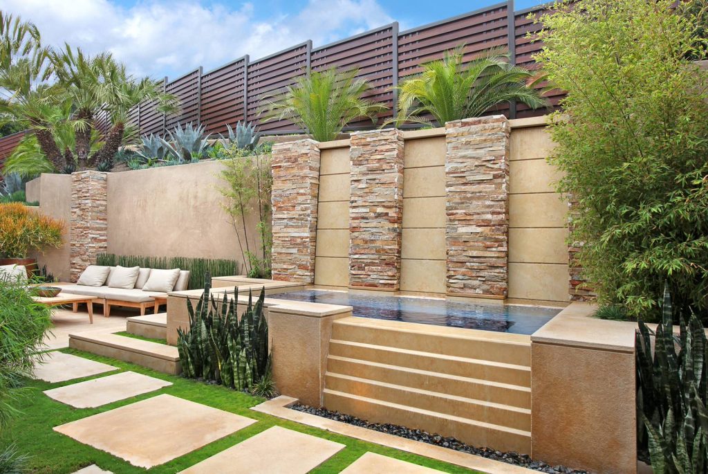 Inspiration for a large contemporary backyard tile and rectangular hot tub remodel in Orange County