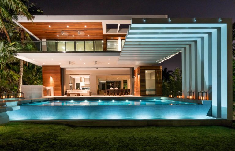 Inspiration for a large contemporary backyard tile and rectangular infinity hot tub remodel in Miami