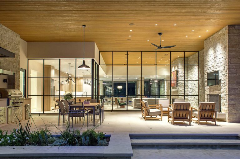 Inspiration for a large contemporary backyard tile patio kitchen remodel in Austin with a roof extension