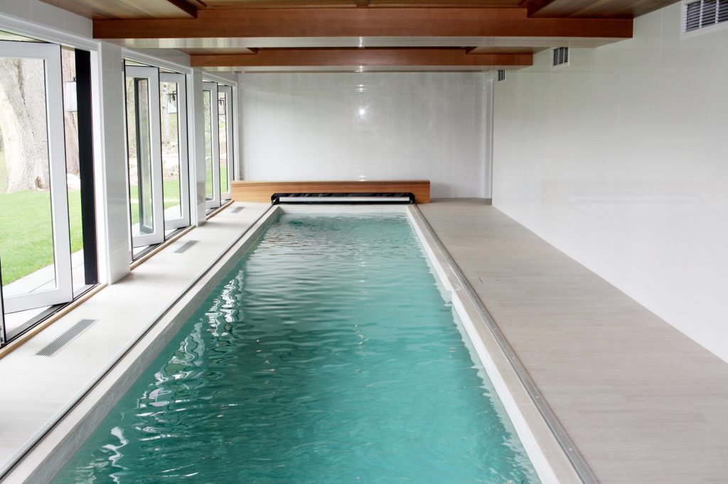 Inspiration for a large contemporary indoor tile and rectangular lap pool remodel in Bridgeport