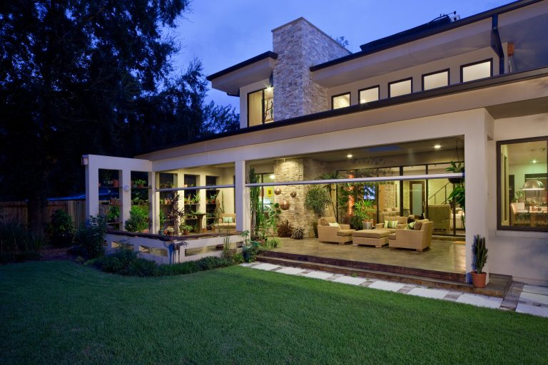 Inspiration for a large contemporary stamped concrete screened-in back porch remodel in Minneapolis with a roof extension by Minnesota Screens | Outdoor Photos | Porch | Landscaping | Landscape Design | Outdoor Living Space | Porch Design Ideas | Outdoor Living Space Ideas | Backyard Design