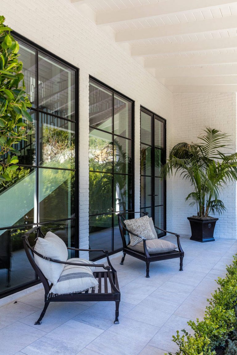 Inspiration for a large contemporary tile front porch remodel in Los Angeles with a roof extension by Kym Rodger Design | Outdoor Photos | Porch | Landscaping | Landscape Design | Outdoor Living Space | Porch Design Ideas | Outdoor Living Space Ideas | Backyard Design