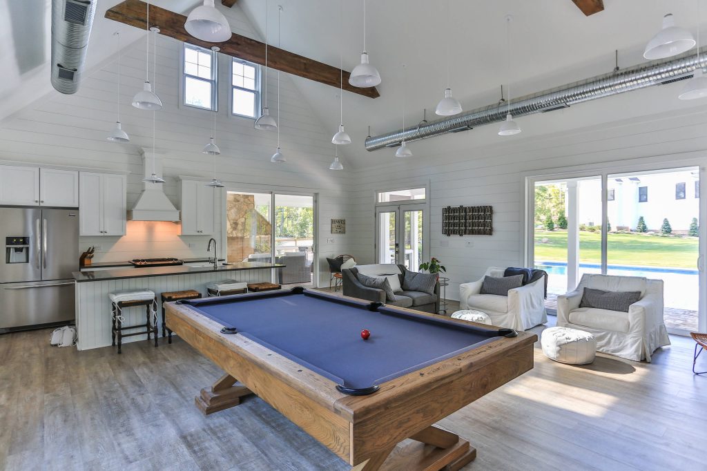 Inspiration for a large cottage backyard pool house remodel in Raleigh