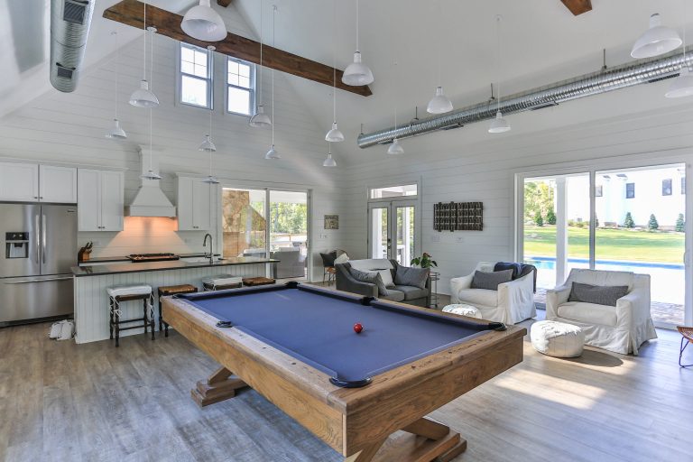 Inspiration for a large cottage backyard pool house remodel in Raleigh