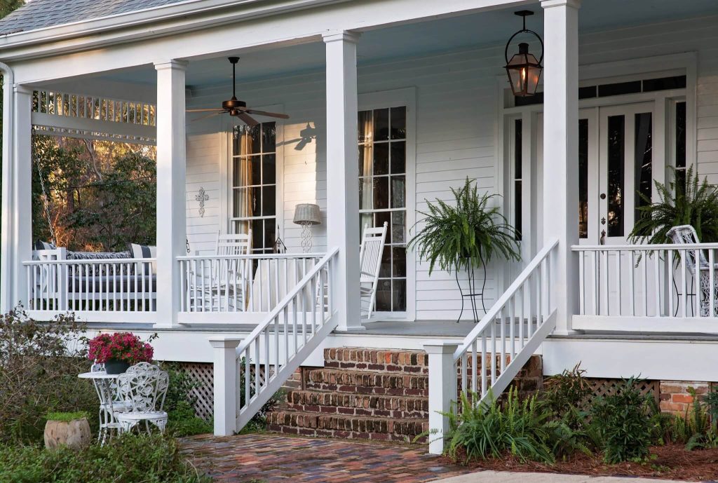 Inspiration for a large cottage brick front porch remodel in Other with a roof extension by Suzanne Winston and Associates | Outdoor Photos | Porch | Landscaping | Landscape Design | Outdoor Living Space | Porch Design Ideas | Outdoor Living Space Ideas | Backyard Design