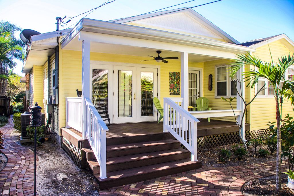 Inspiration for a large craftsman front porch remodel in Tampa with decking and a roof extension by Voss Builders | Outdoor Photos | Porch | Landscaping | Landscape Design | Outdoor Living Space | Porch Design Ideas | Outdoor Living Space Ideas | Backyard Design