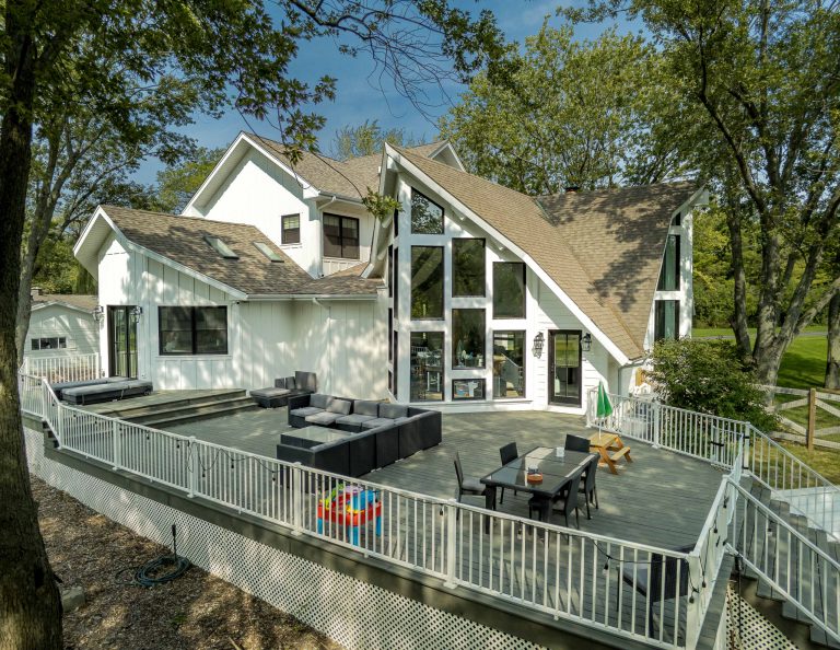 Inspiration for a large farmhouse backyard ground level wood railing outdoor kitchen deck remodel in Chicago with no cover