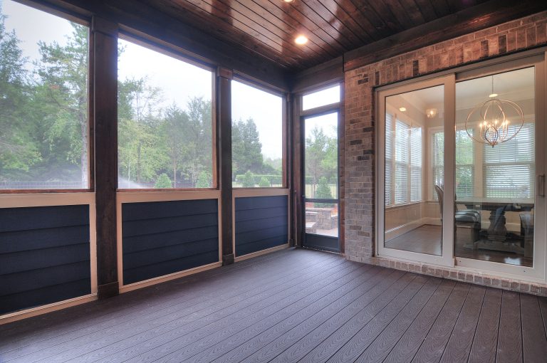 Inspiration for a large industrial screened-in back porch remodel in Charlotte with decking and a roof extension by Linnane Homes | Outdoor Photos | Porch | Landscaping | Landscape Design | Outdoor Living Space | Porch Design Ideas | Outdoor Living Space Ideas | Backyard Design