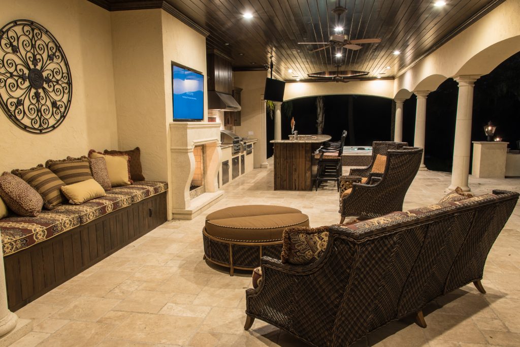 Inspiration for a large mediterranean patio kitchen remodel in Jacksonville with a roof extension