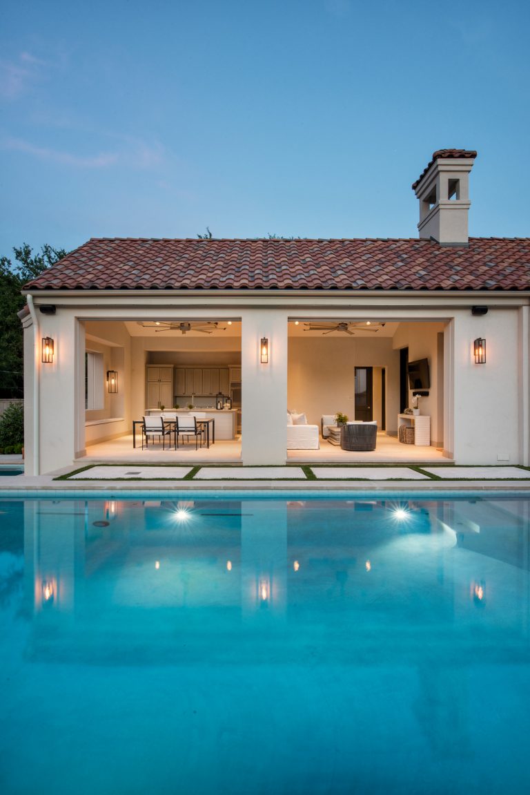 Inspiration for a large modern backyard concrete and rectangular infinity pool remodel in Dallas