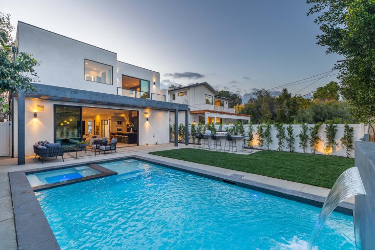 Inspiration for a large modern backyard concrete and rectangular lap pool remodel in Los Angeles