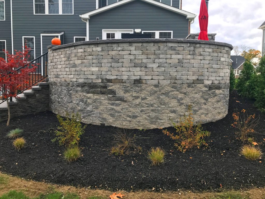 Inspiration for a large modern backyard concrete paver patio kitchen remodel in Other with no cover