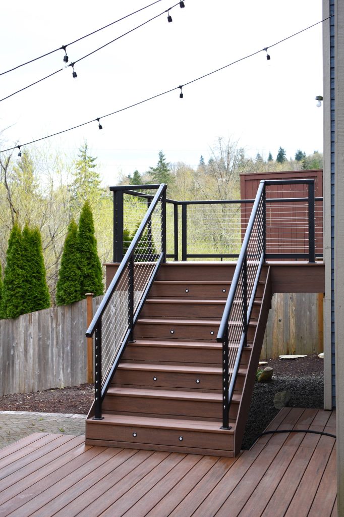 Inspiration for a large modern backyard deck remodel in Seattle with no cover