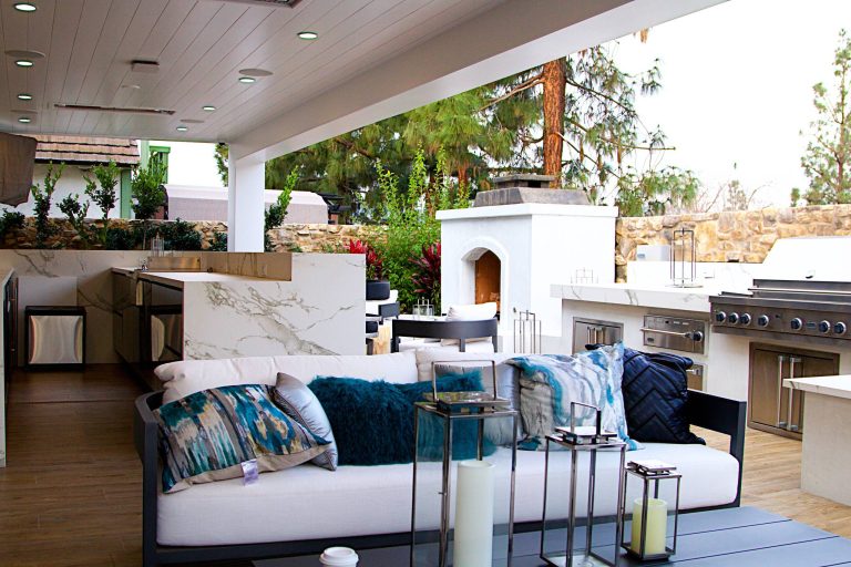 Inspiration for a large modern backyard patio kitchen remodel in Orange County with decking and a roof extension