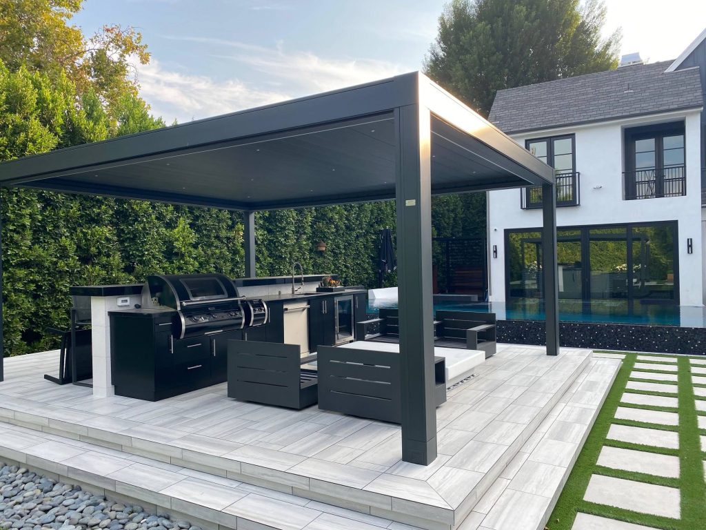 Inspiration for a large modern backyard tile and rectangular infinity pool landscaping remodel in Orange County