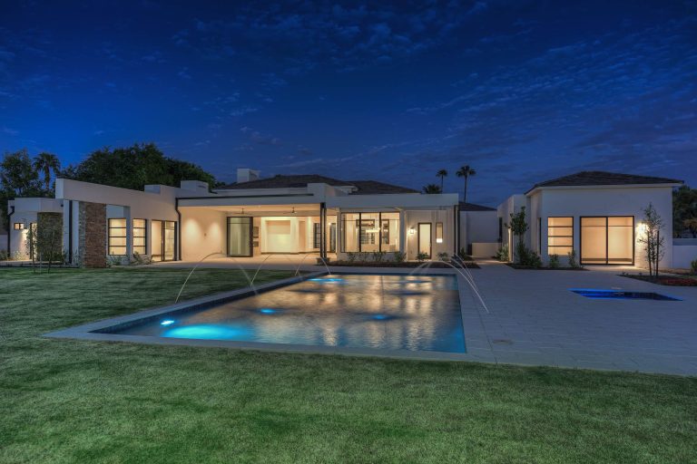 Inspiration for a large modern partial sun backyard stone landscaping in Phoenix for spring.