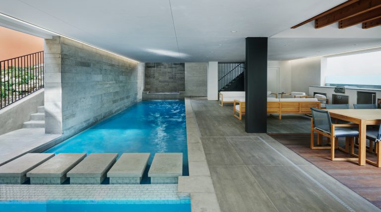 Inspiration for a large modern tile pool fountain remodel in Austin