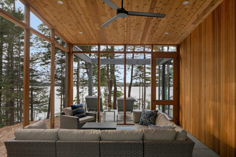 Inspiration for a large rustic concrete paver screened-in side porch remodel in Portland Maine with a roof extension by Acorn Deck House Company | Outdoor Photos | Porch | Landscaping | Landscape Design | Outdoor Living Space | Porch Design Ideas | Outdoor Living Space Ideas | Backyard Design