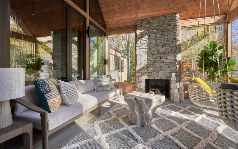 Inspiration for a large rustic stone front porch remodel in Other with a fireplace and a roof extension by Michael Ross Kersting Architecture, P.A. | Outdoor Photos | Porch | Landscaping | Landscape Design | Outdoor Living Space | Porch Design Ideas | Outdoor Living Space Ideas | Backyard Design