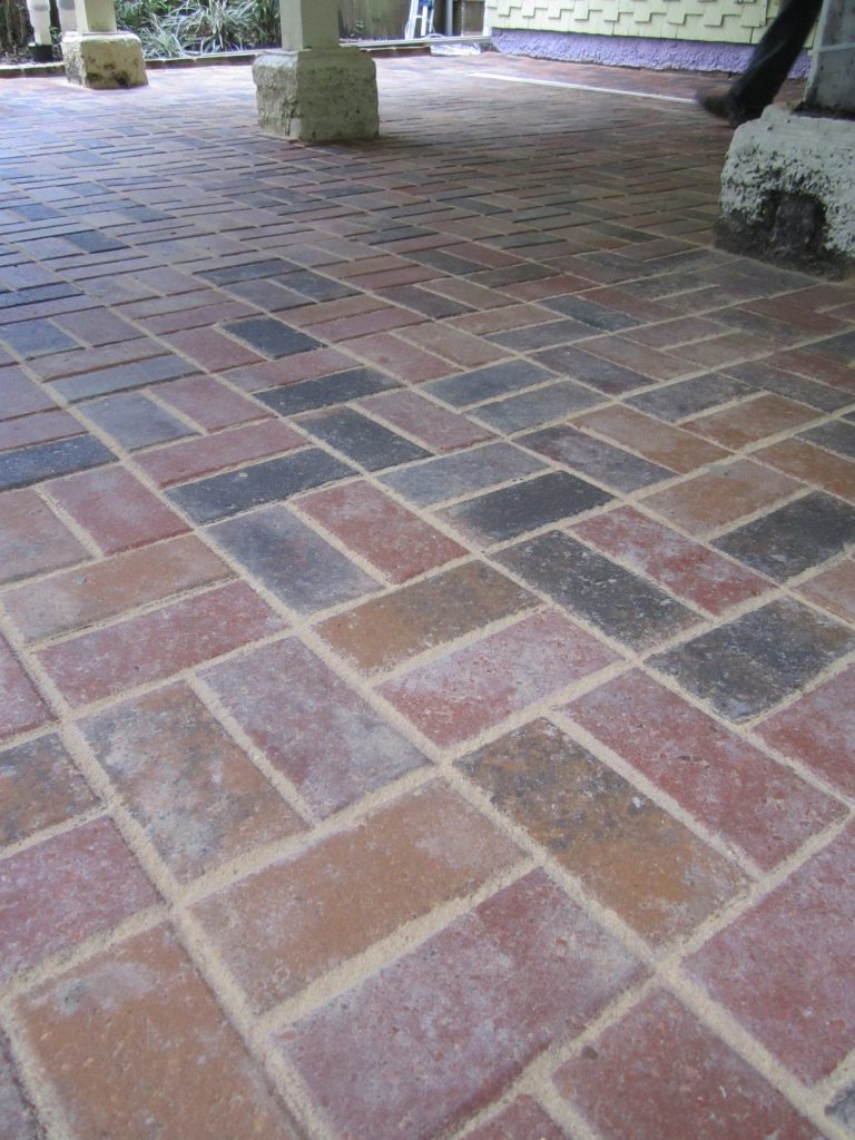 Inspiration for a large timeless backyard brick patio kitchen remodel in New Orleans with a gazebo