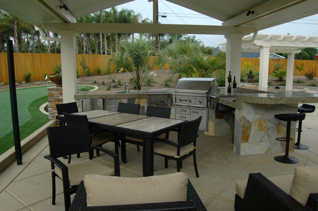 Inspiration for a large timeless backyard concrete patio kitchen remodel in San Diego