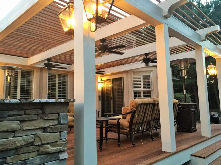 Inspiration for a large timeless backyard patio kitchen remodel in Charlotte with decking and a pergola