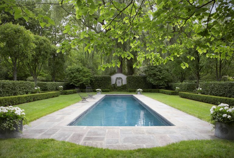 Inspiration for a large timeless backyard rectangular and tile natural pool remodel in New York