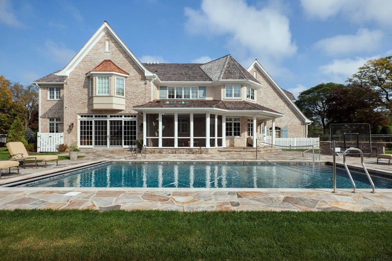 Inspiration for a large timeless backyard stone and rectangular lap pool remodel in Chicago