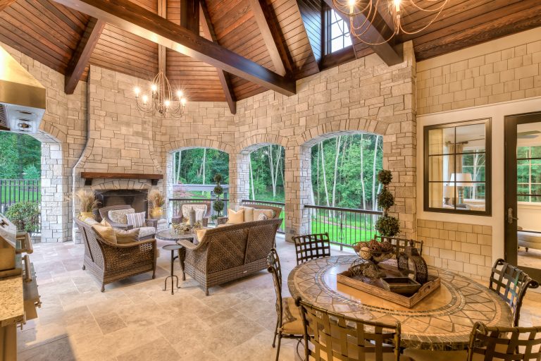 Inspiration for a large timeless backyard stone patio kitchen remodel in Grand Rapids with a gazebo